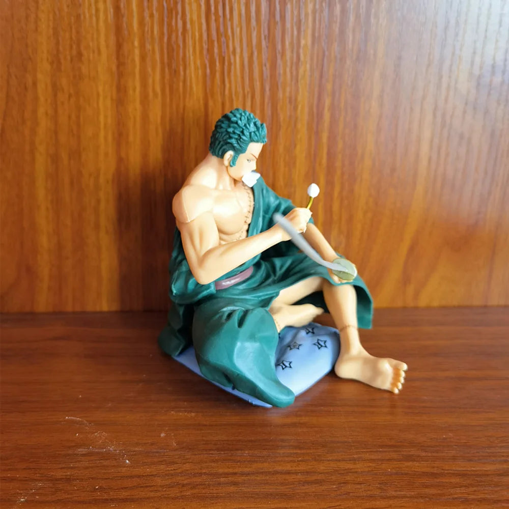 Zoro Sitting with Sword Figurine: Detailed Anime Collectible for Fans, Perfect Gift for Sword Enthusiasts & Decor Lovers.