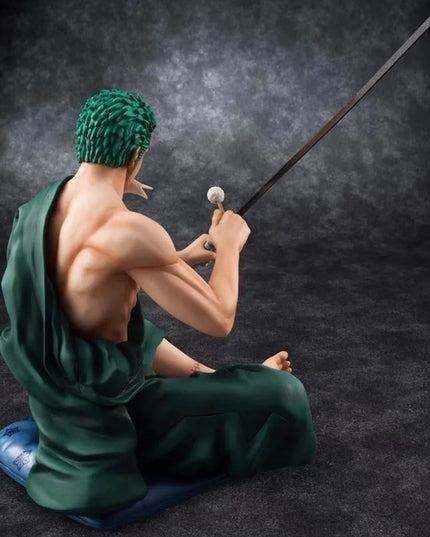 Zoro Sitting with Sword Figurine: Detailed Anime Collectible for Fans, Perfect Gift for Sword Enthusiasts & Decor Lovers.