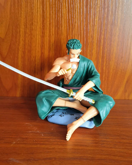 Zoro Sitting with Sword Figurine: Detailed Anime Collectible for Fans, Perfect Gift for Sword Enthusiasts & Decor Lovers.